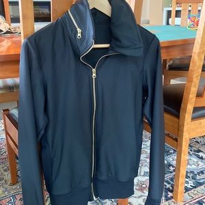Excellent condition Lululemon black zipper jacket with gold detail, hidden hood